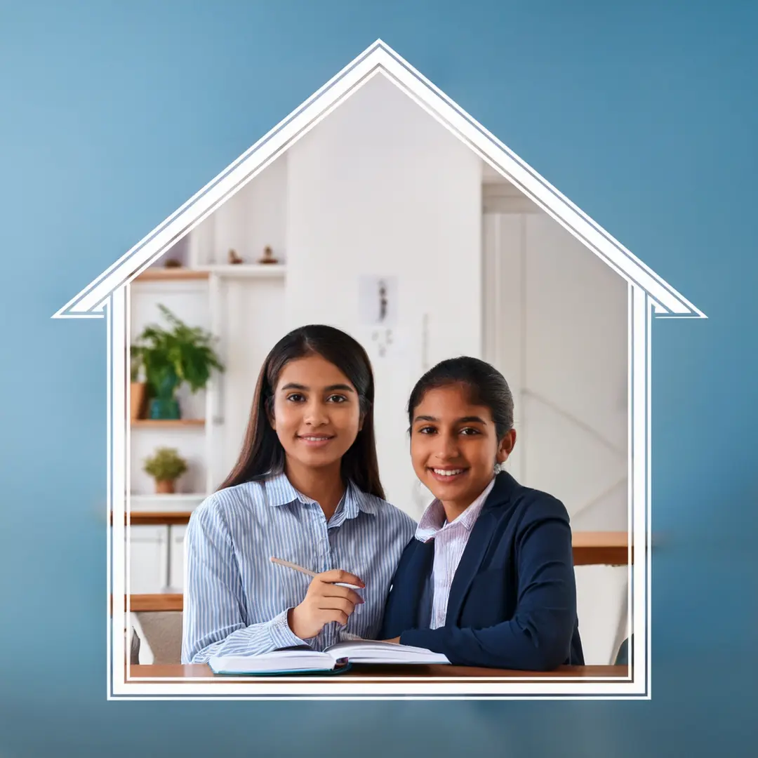 a teacher and a student sitting at a desk. The teacher came from Best Home Tutor Bureau in West Delhi.